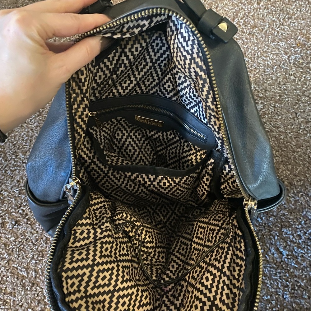 Leather backpack with zipper pockets